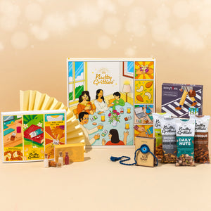 Rakhi Celebration Hamper for brother (7 inclusions)- Thai Chilli Blend 40g, Smoked Cocktail Mixed Nuts 40g, Daily Nuts 35g, Barbeque Almonds 40g, SoxyToes Socks, with Plantable Seed Rakhi & Roli Chawal Chandan Mishri Set