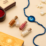 Rakhi Celebration Hamper for brother (7 inclusions)- Thai Chilli Blend 40g, Smoked Cocktail Mixed Nuts 40g, Daily Nuts 35g, Barbeque Almonds 40g, SoxyToes Socks, with Plantable Seed Rakhi & Roli Chawal Chandan Mishri Set